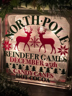 Close-up of North Pole Reindeer Games, December 25th, Candy Canes and Hot Cocoa lettering