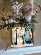 Birch tree light box topped with a white snowflake and evergreen