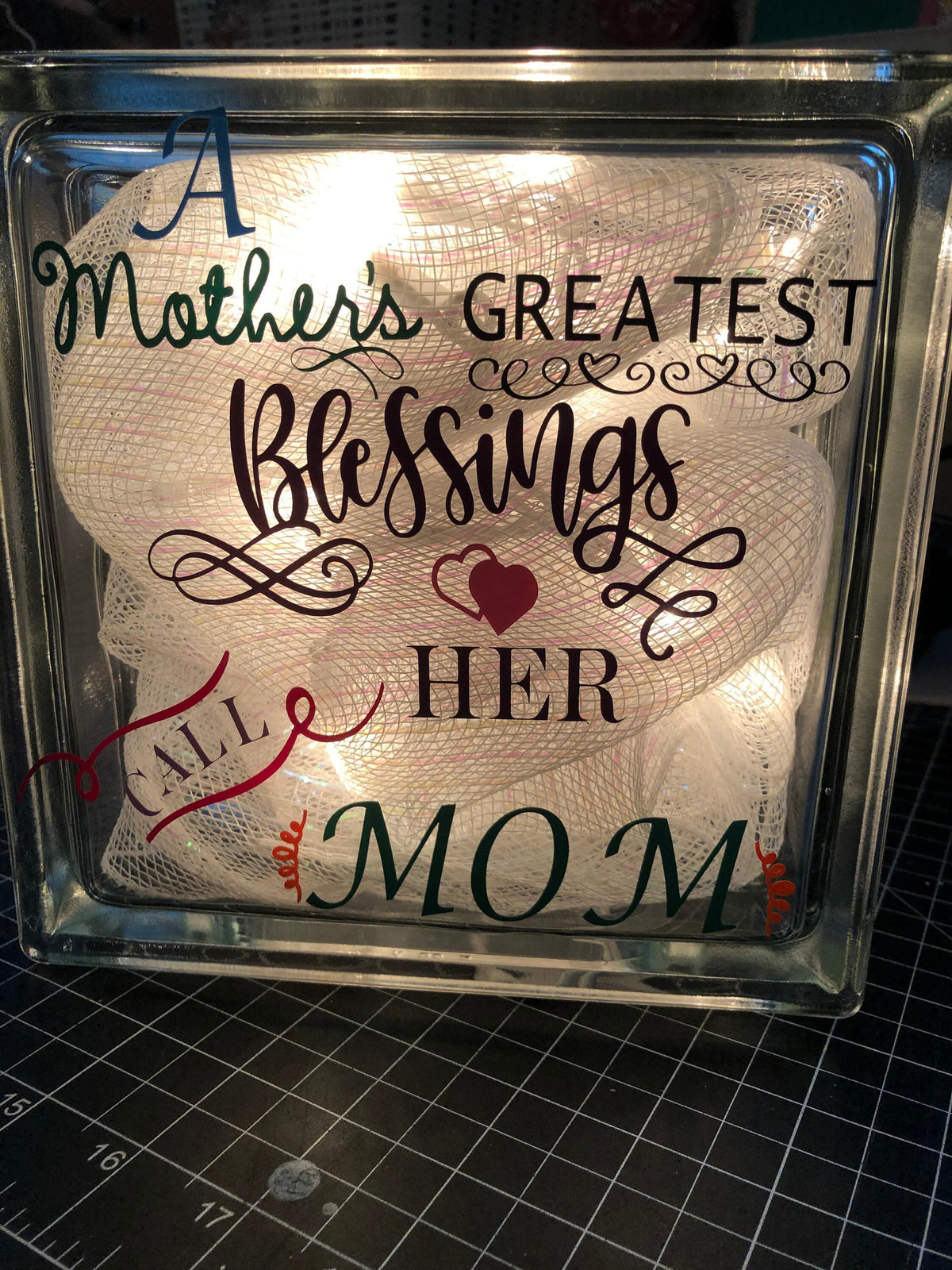 Close-up of the A Mother's Greatest Blessings Call Her Mom lettering on the glowing block